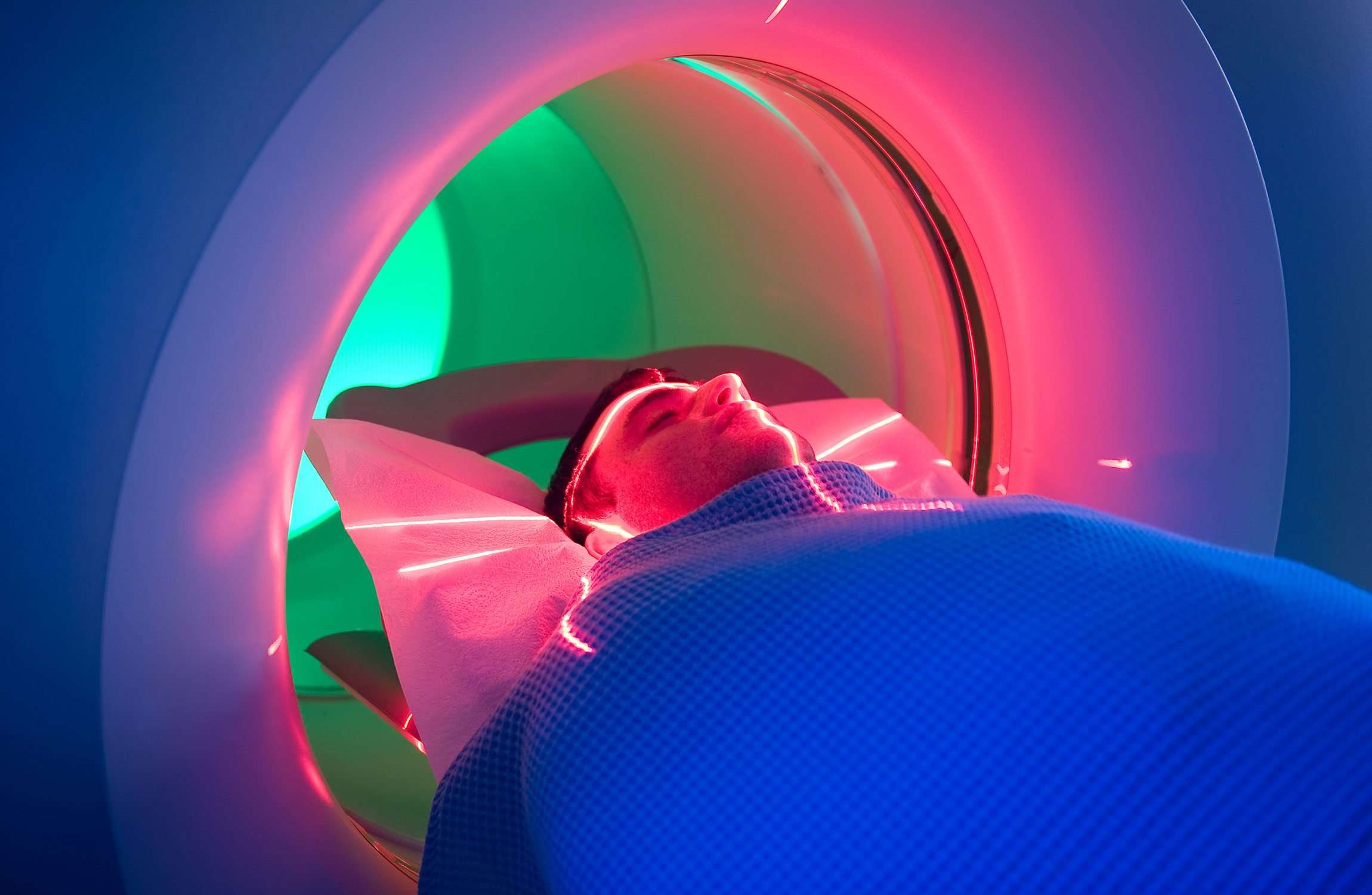 man in a pet scanner